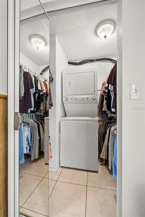 Large walk-in closet with stackable washer/dryer
