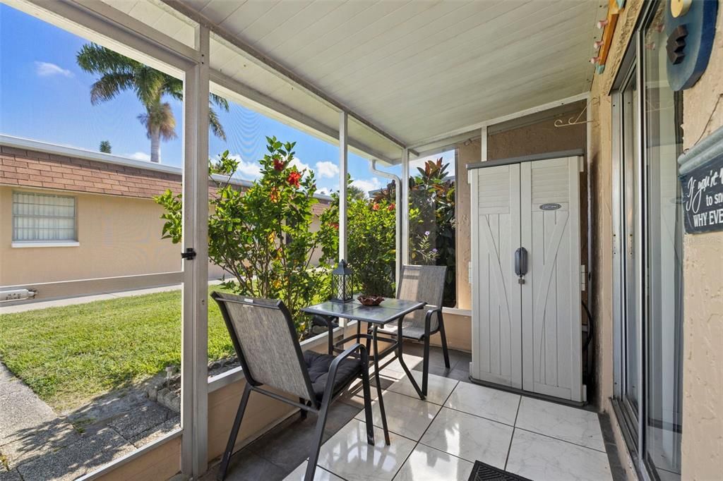 Screened-in lanai which is roomy enough for seating and storage.  This lanai is just steps away from the community pool and clubhouse.