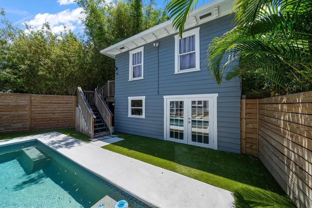 Two-car garage and renovated guest quarters located behind the main home