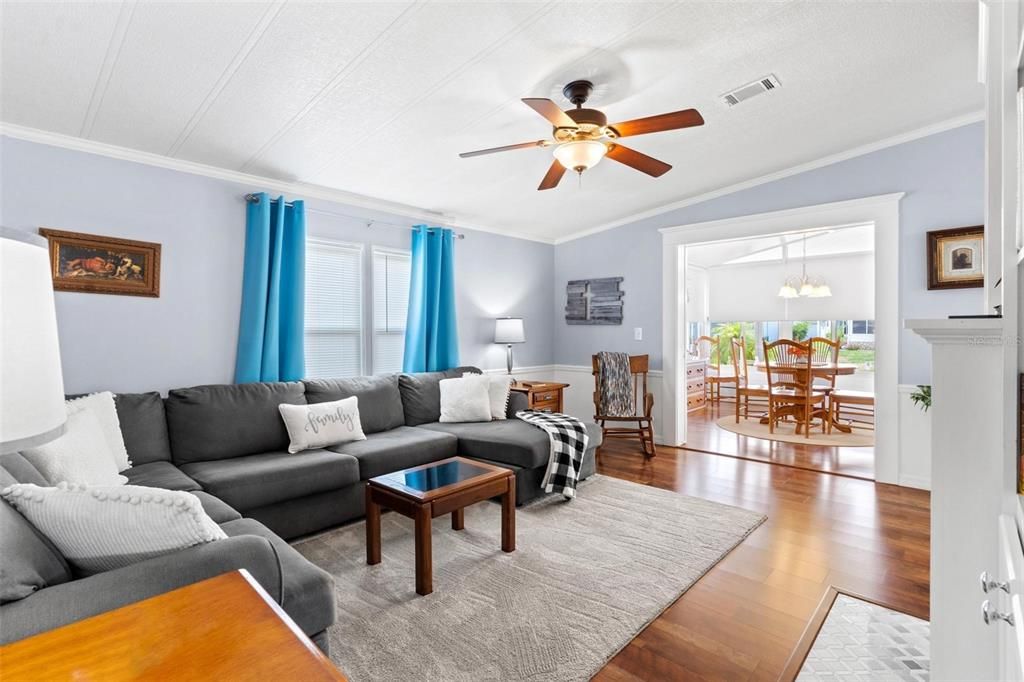 LIVING ROOM WITH VIEW OF DINING ROOM IN SUN ROOM