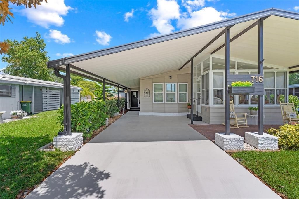 ANOTHER VIEW OF CARPORT AND OPEN PORCH/PATIO