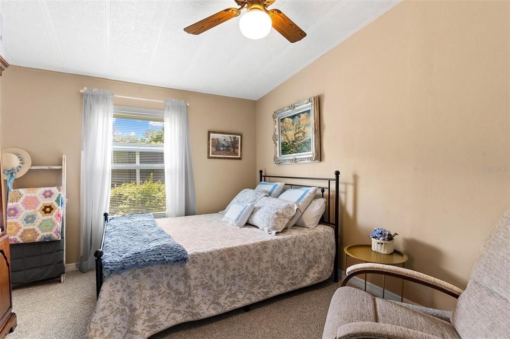 GUEST BEDROOM WITH WALK-IN CLOSET AND CEILING FAN