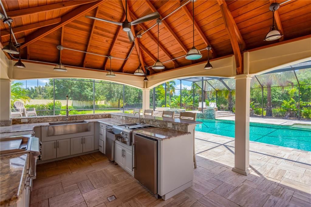 Outdoor grill, hibachi cooktop, wine fridge and more under the pavilion.