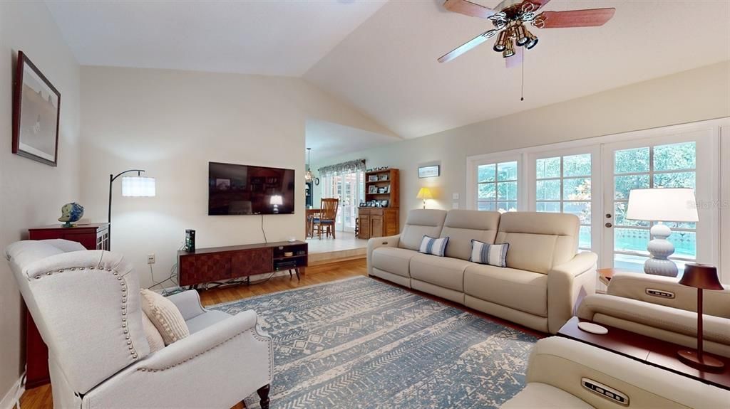 Family room toward Kitchen, view to lanai/pool