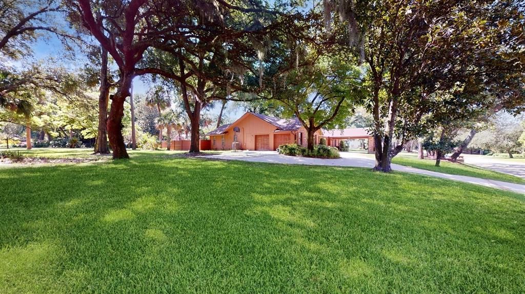 view from curb at corner of  lot