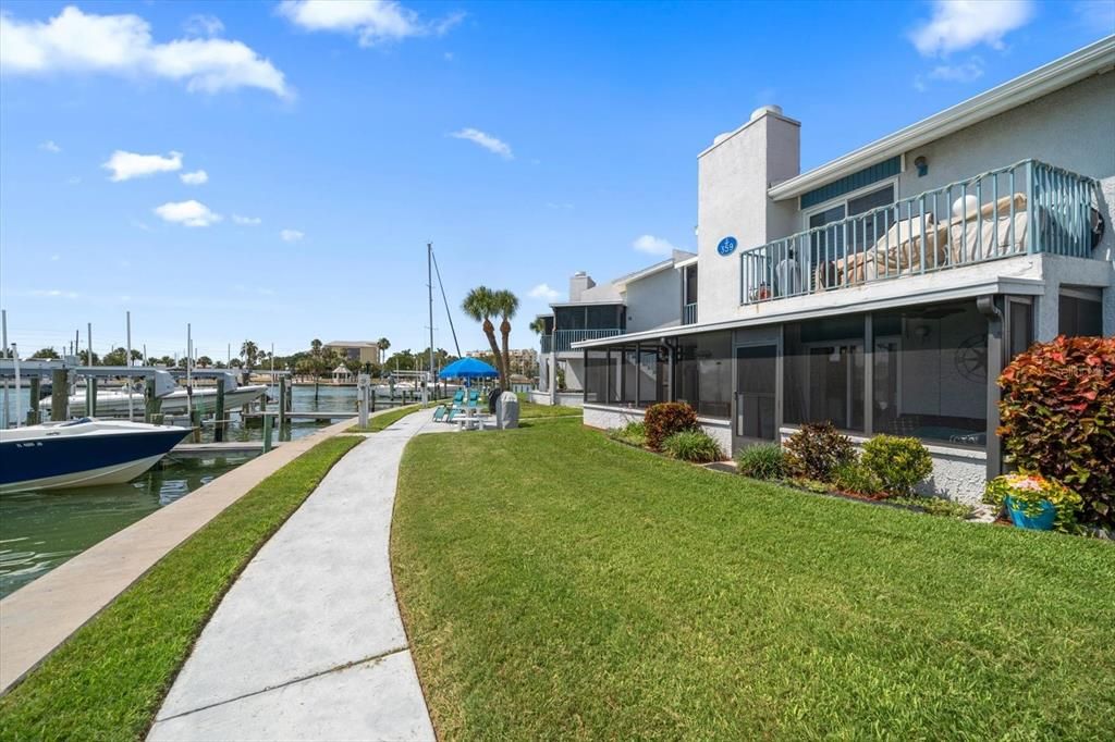 Sidewalk to back porch and boat slip