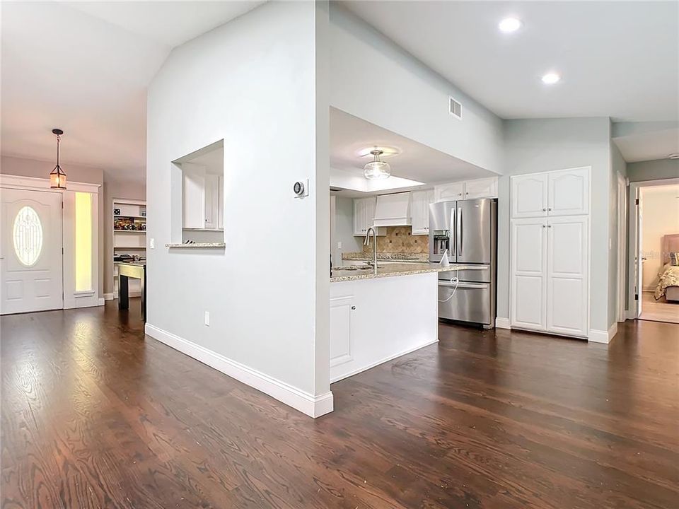 The kitchen is open and bright and light