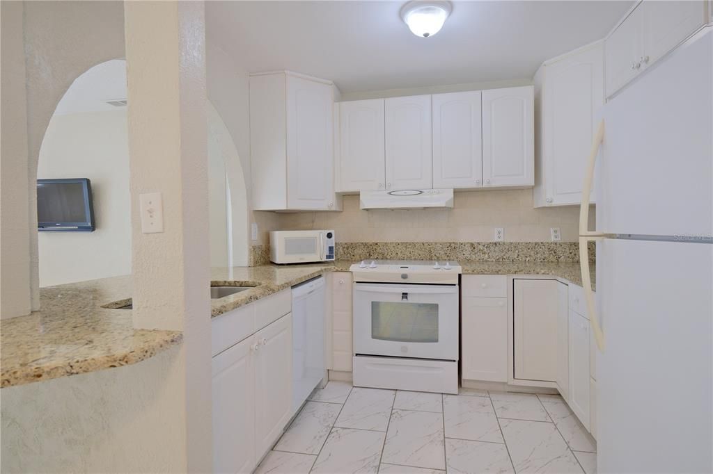 GENEROUS GRANITE COUNTERTOPS W/ BREAKFAST BAR!