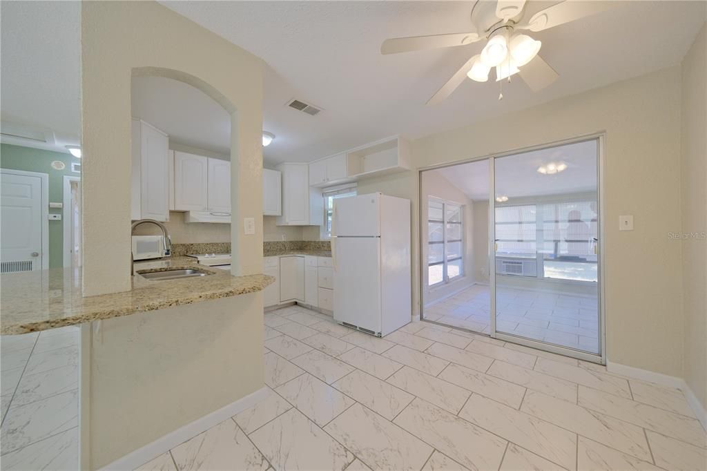 UNDER ROOF-ENCLOSED LANAI OFF DINING AREA!  GREAT FLOOR PLAN!