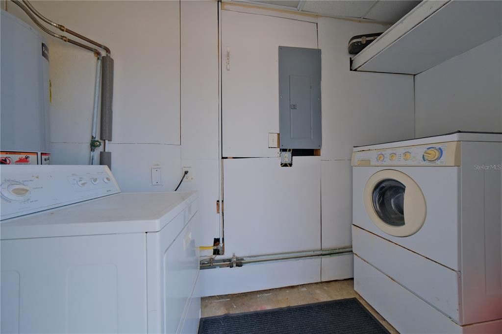 WASHER AND DRYER INCLUDED WITH ADDITIONAL STORAGE SPACE OFF CARPORT.