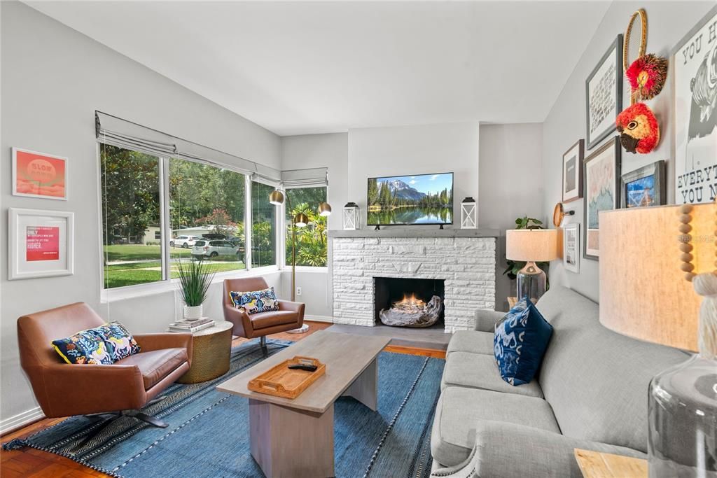 Family room features large windows overlooking front lawn. Custom blinds can be lowered from the top down to provide partial shade and privacy.