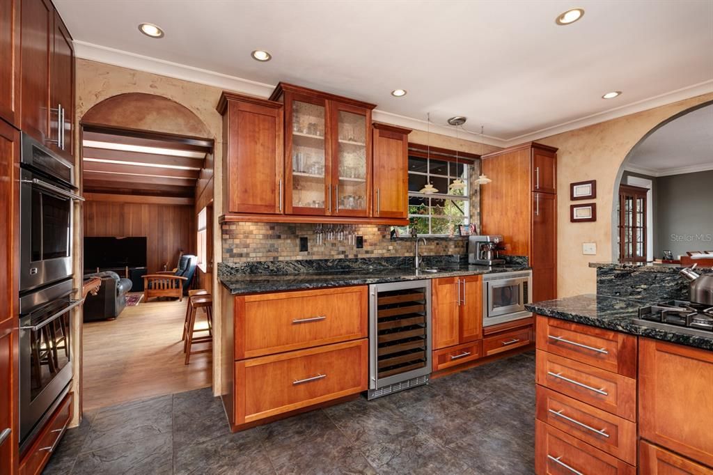 Double built in ovens, counter depth refrigeration, 52 bottle wine fridge and 70 square feet of solid granite