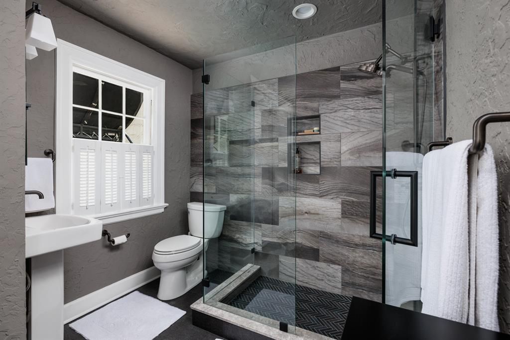 Modern shower in the fully remodeled primary bathroom