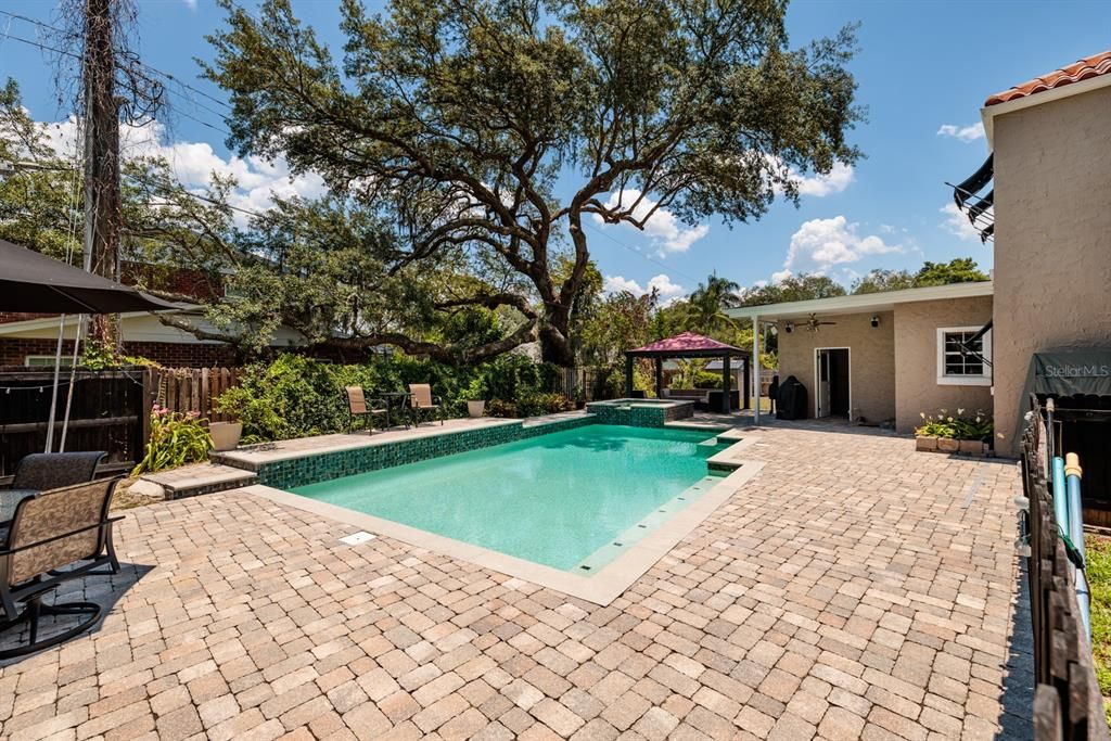 The pool is surrounded by 1500 square feet of pavers