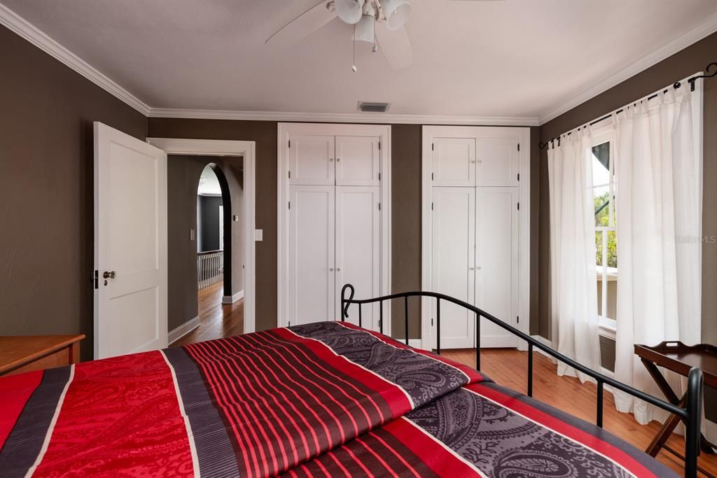 Spacious bedroom with large closets and tall storage