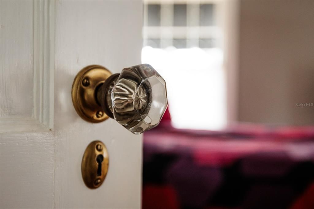 Enter the primary bedroom.  All of the original hardware in this home has been meticulously restored by the owners over the last 25 years