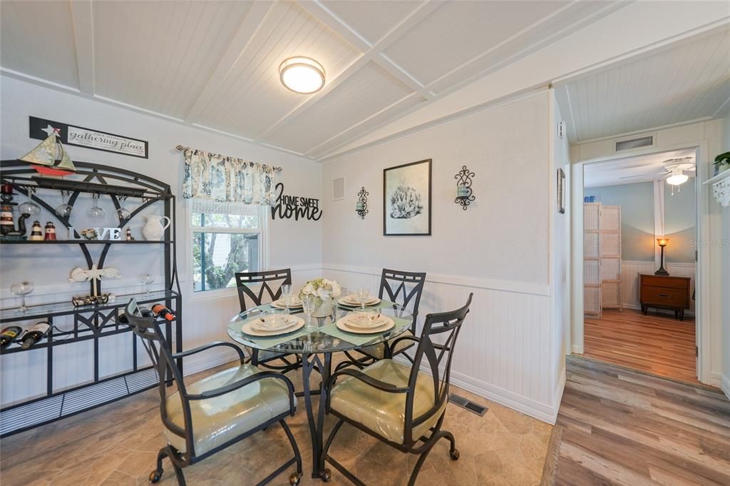 dining room with bedroom door entrance pictured here