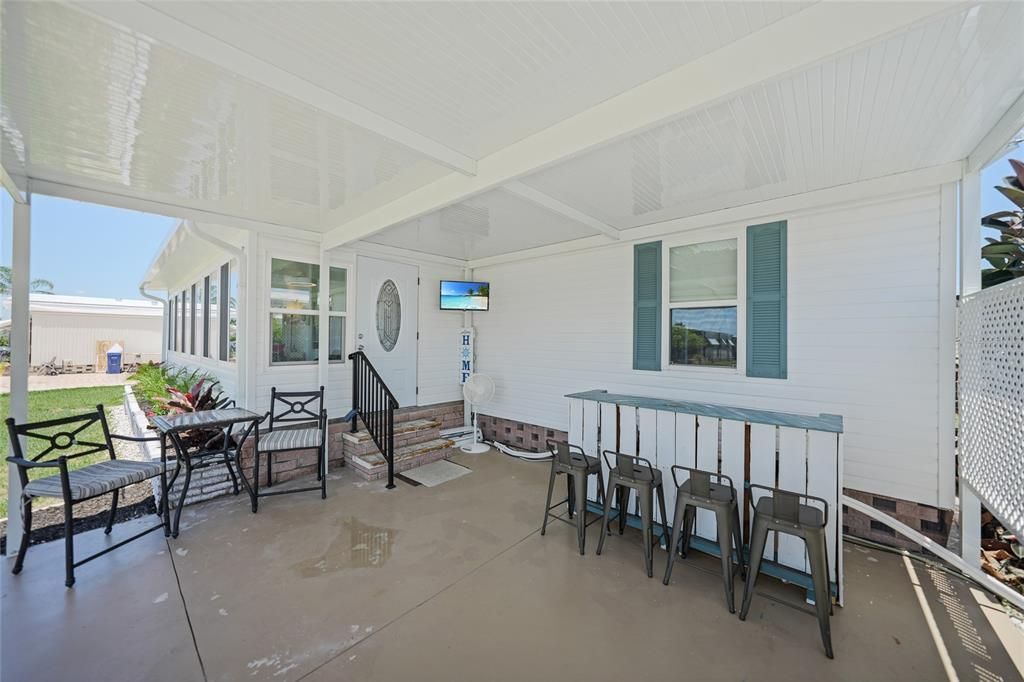 brand new carport with bar and tv