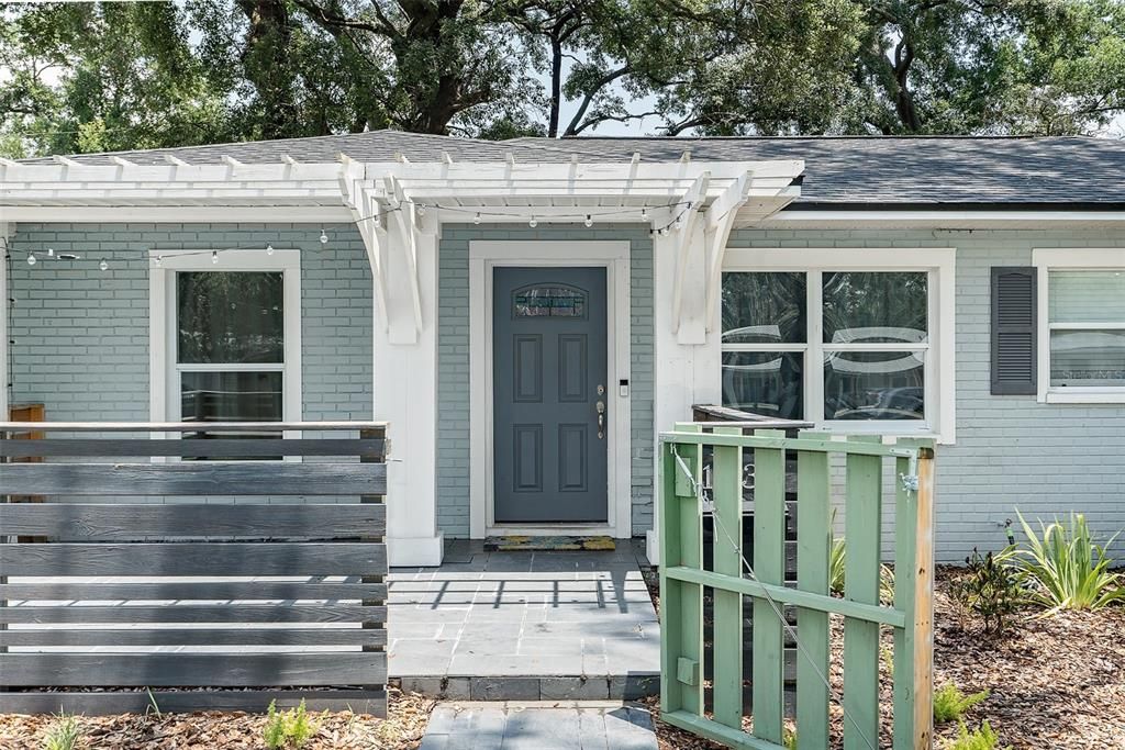 Guests will feel welcome with the pergola and tiled entryway.