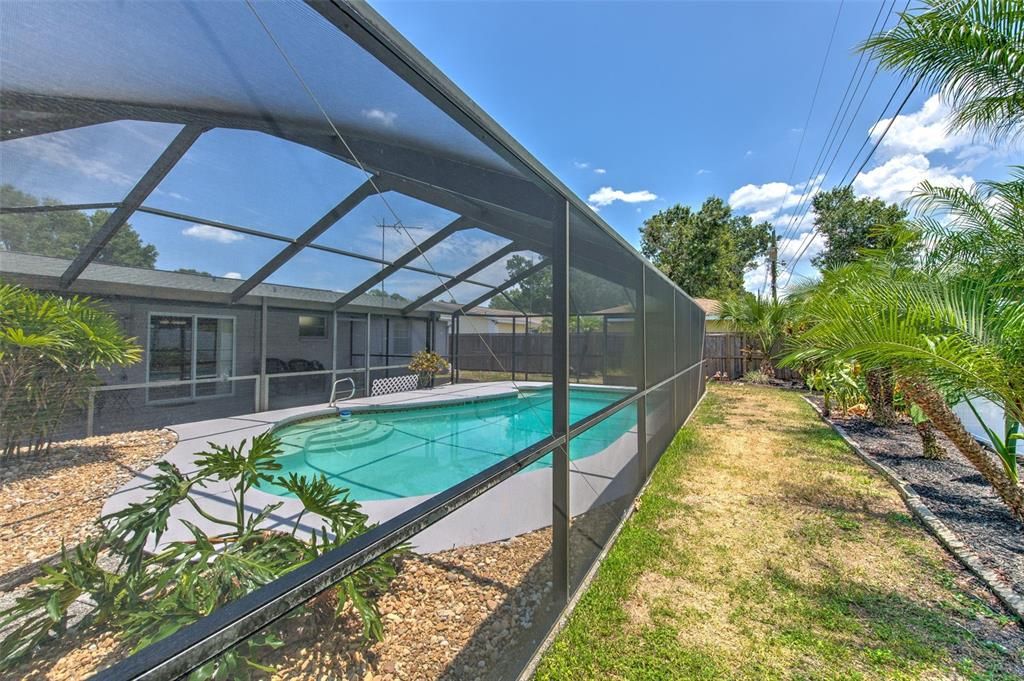 Screened in Pool with fenced backyard & landscaping