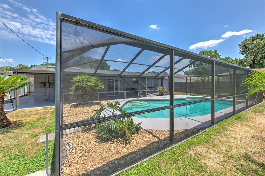 Screened in Pool with fenced backyard & landscaping