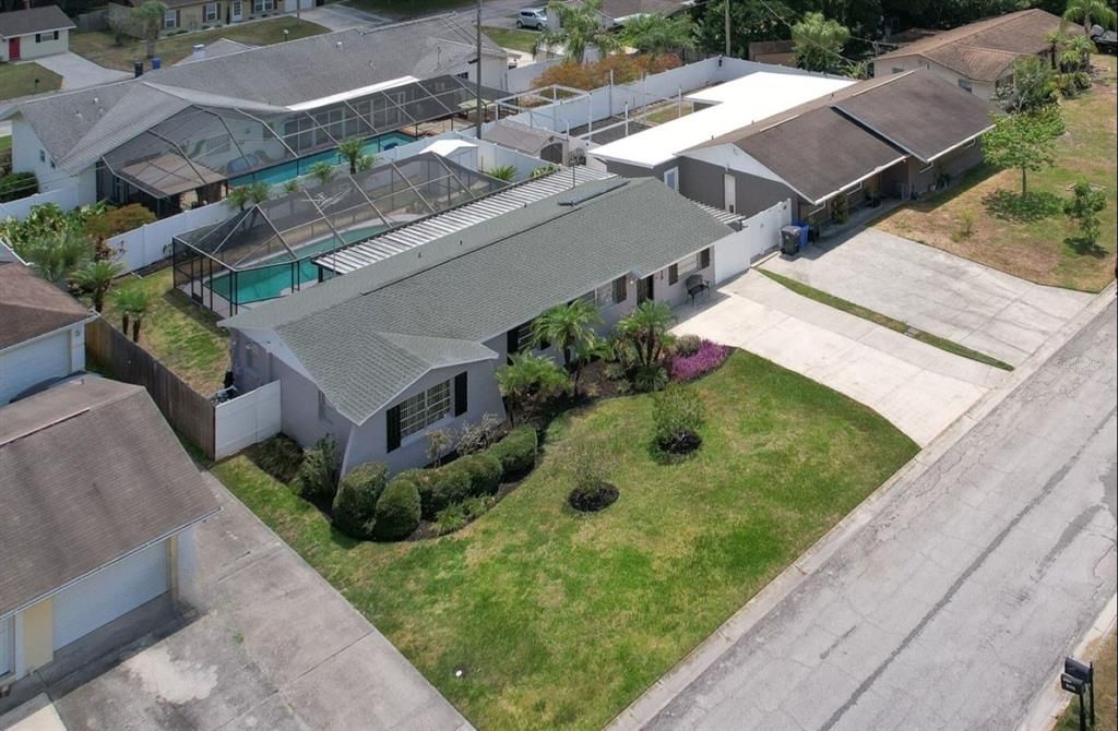 Aerial side view of pool home