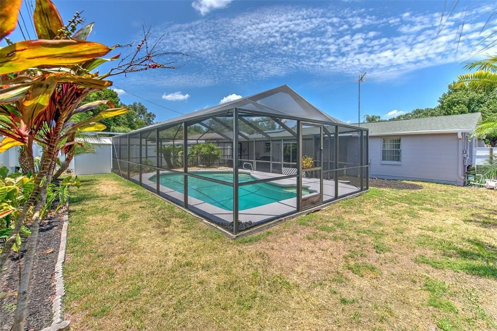 Screened in Pool with fenced backyard & landscaping