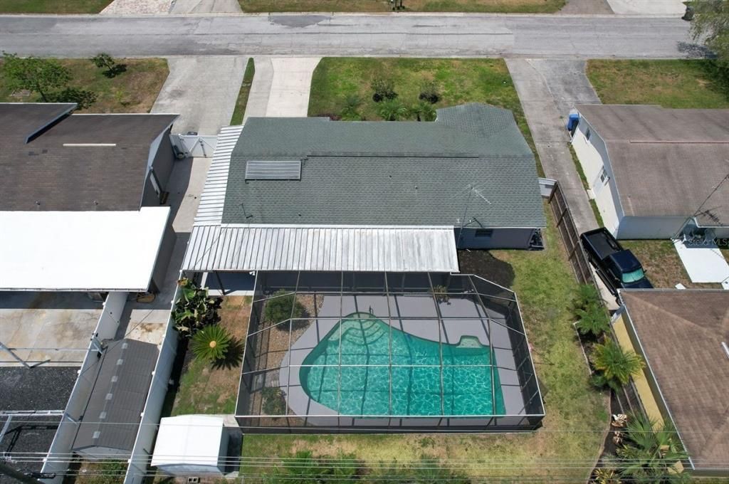 Aerial view of pool home and property