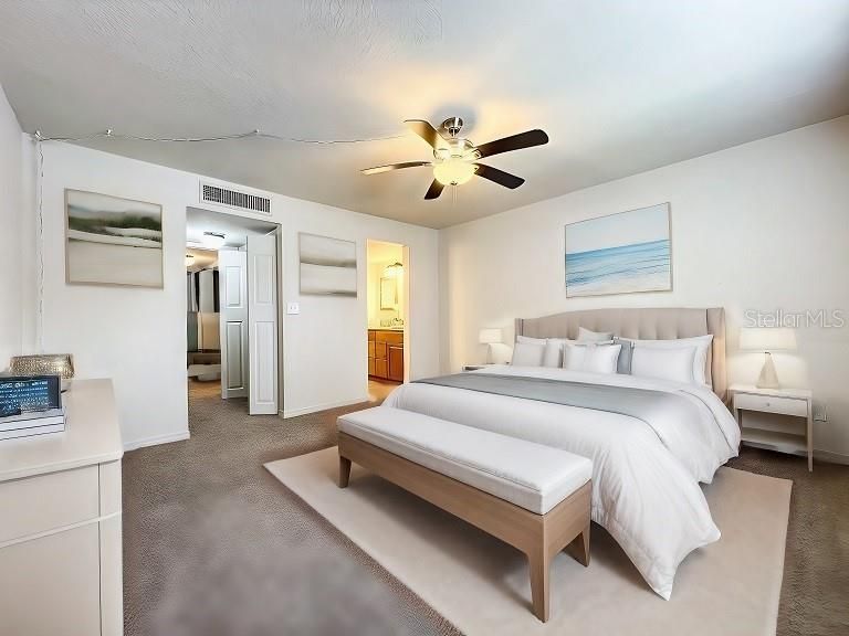 King size primary bedroom shown staged