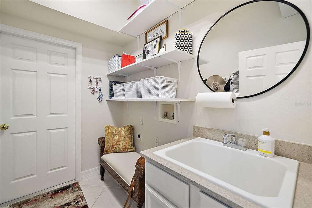 A mud room with laundry hook-ups opens to the garage.