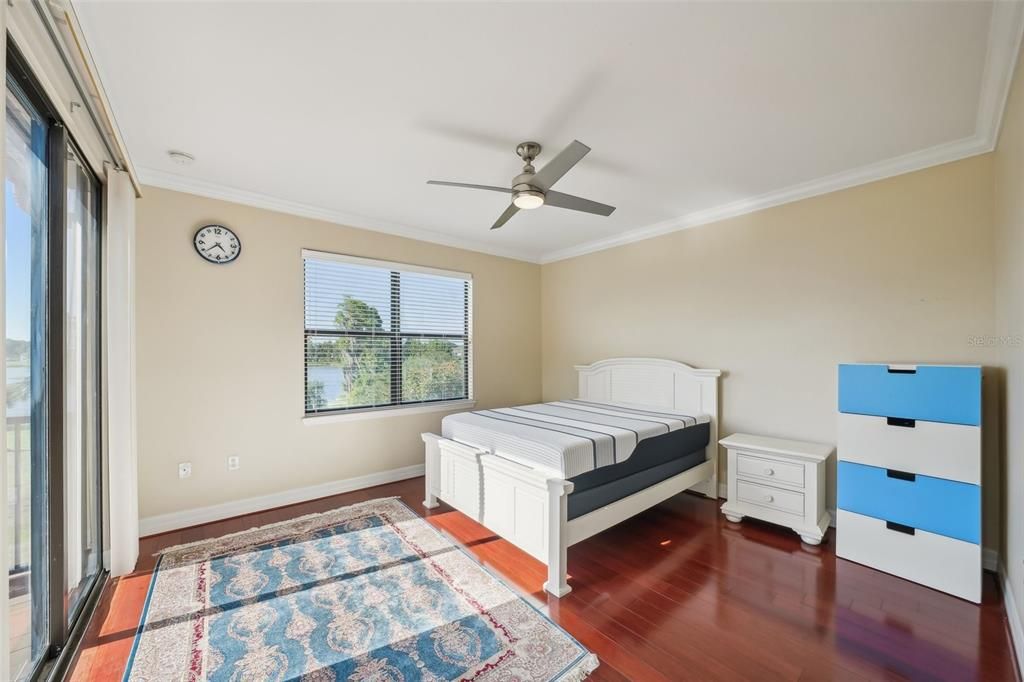 Upstairs bedroom with patio access