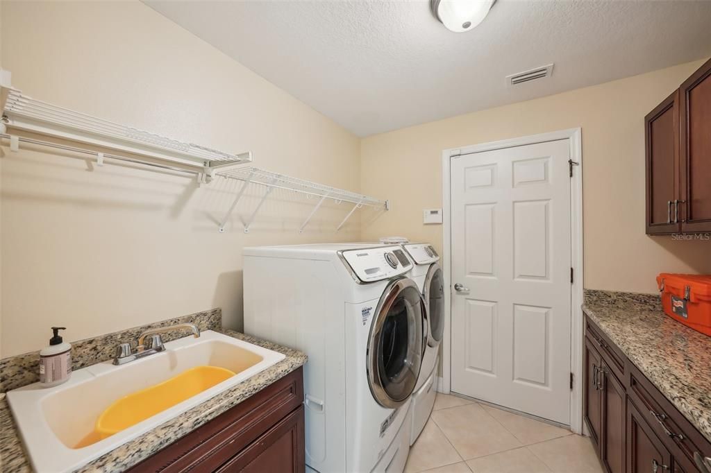 Laundry room leading into the garage