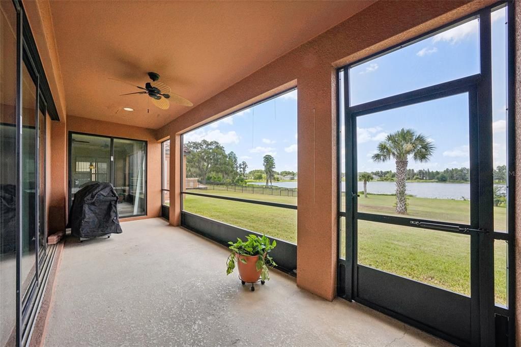 Screened-in patio looking onto the lake, perfect for lounging and entertaining