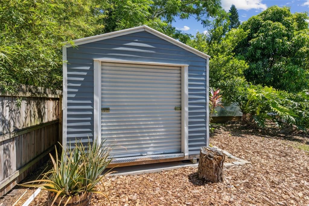 Custom Shed with Roll door on concrete pad