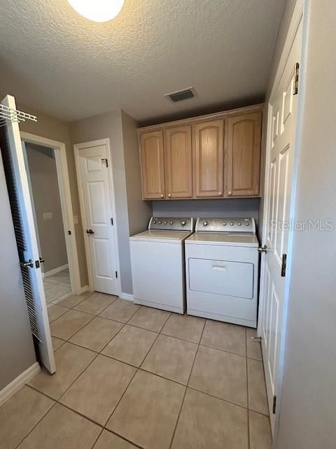 Utility room has Washer and Dryer, along with a work area