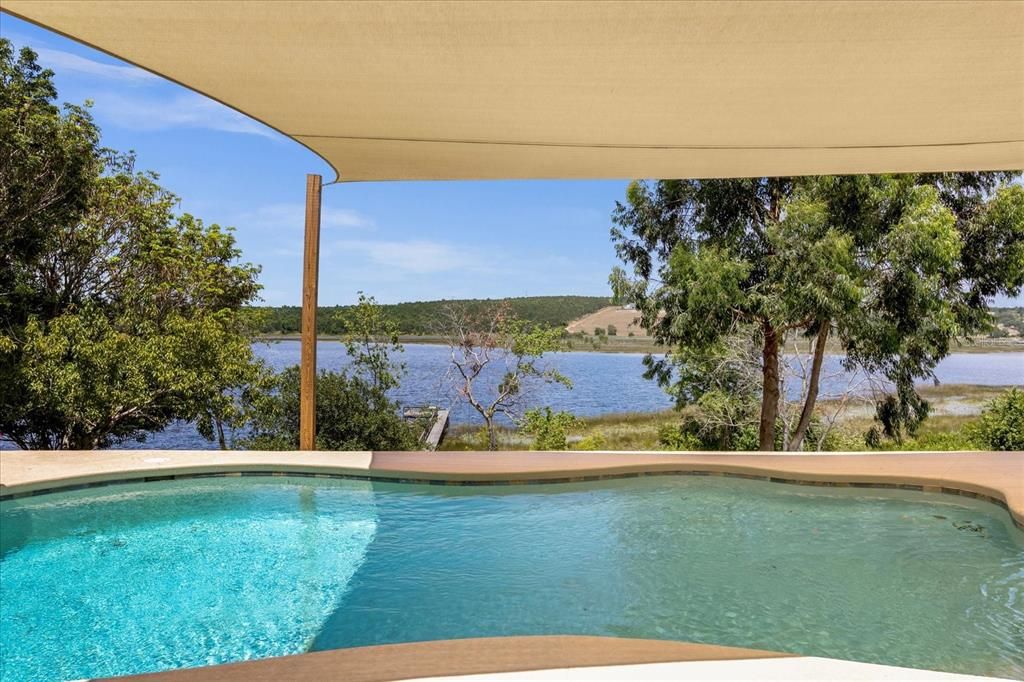 Salt Pool with Shade Cover overlooking Grassy Lake