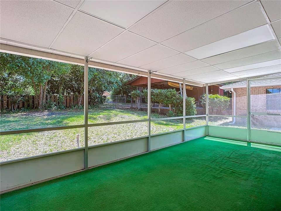 Screened back porch off family room