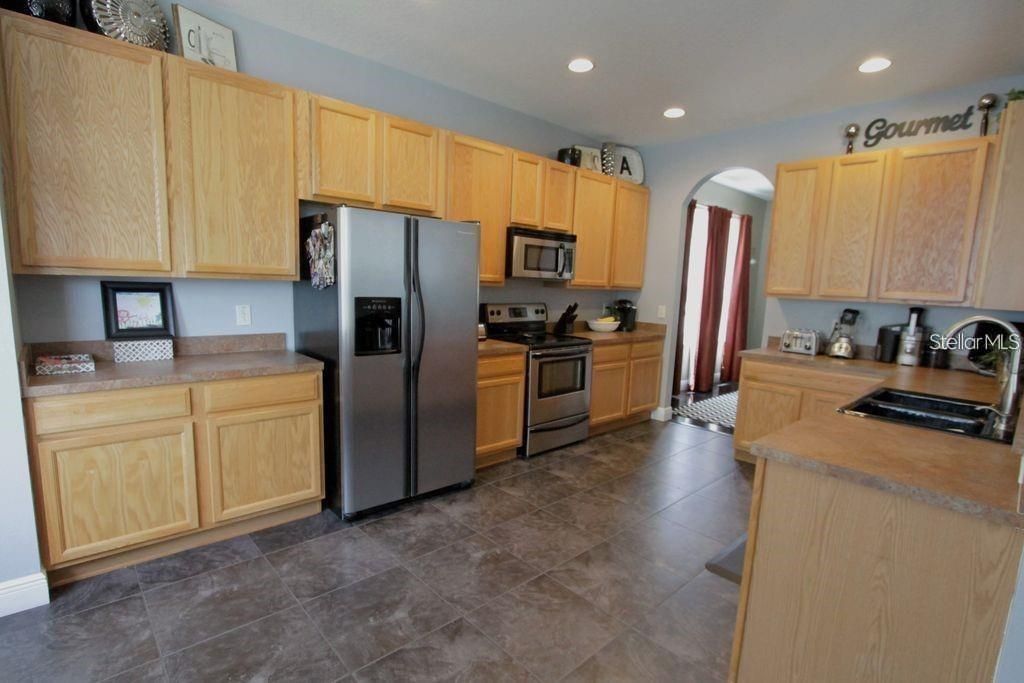 Large Kitchen with Stainless Steel Appliances and ceramic tile floors