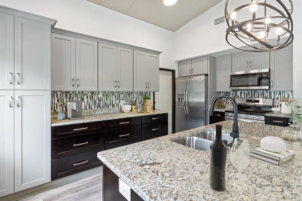 Kitchen with Granite Countertops, Mosaic Backsplash, S/S Appliances, Cabinet Pantry & Island with Breakfast Bar...Virtually Staged