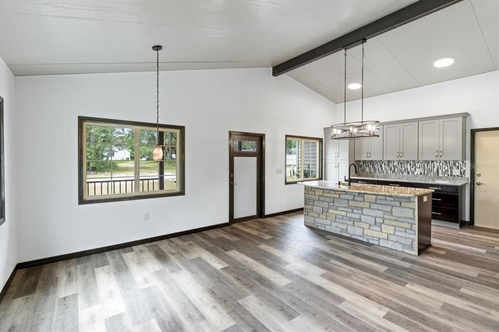 Vaulted Ceilings and Luxury Vinyl Planking Throughout