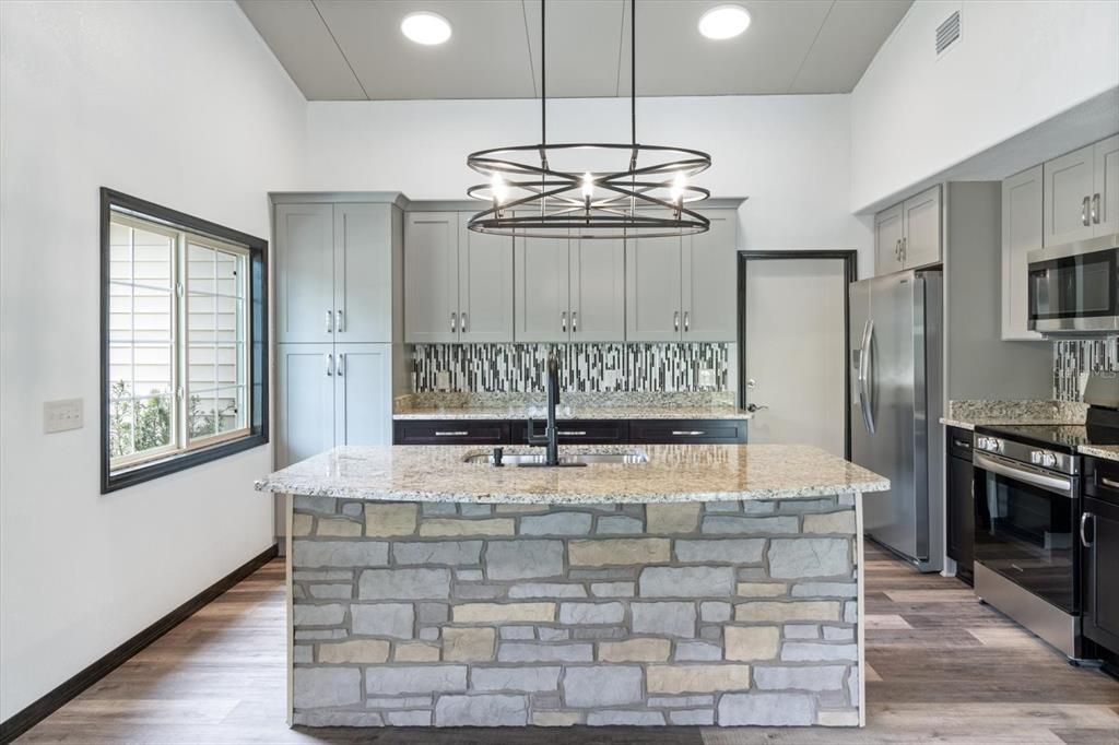 Granite Countertops with Mosaic Backsplash