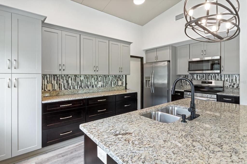 Kitchen with Granite Countertops, Mosaic Backsplash, S/S Appliances, Cabinet Pantry & Island with Breakfast Bar