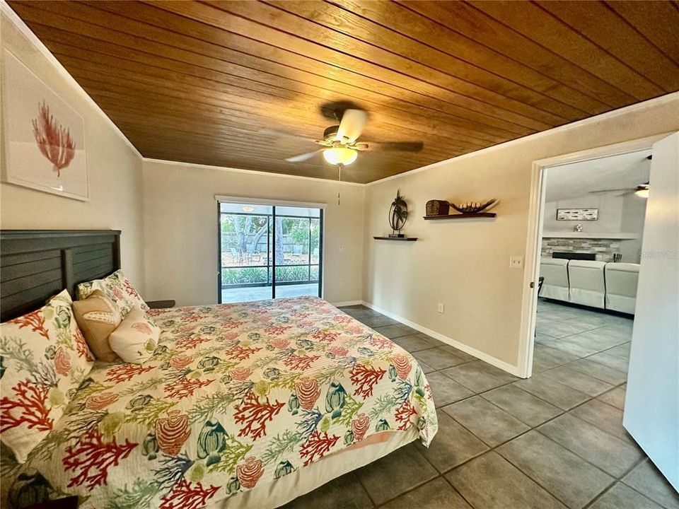 Primary Bedroom with sliding doors to screened lanai