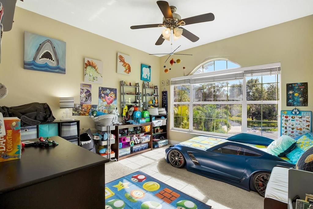 The third bedroom is located toward the front of the house and is also flooded in a natural light