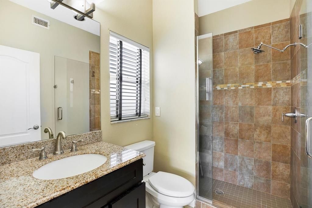 An updated en-suite bathroom with shower so no tub ledges to climb over