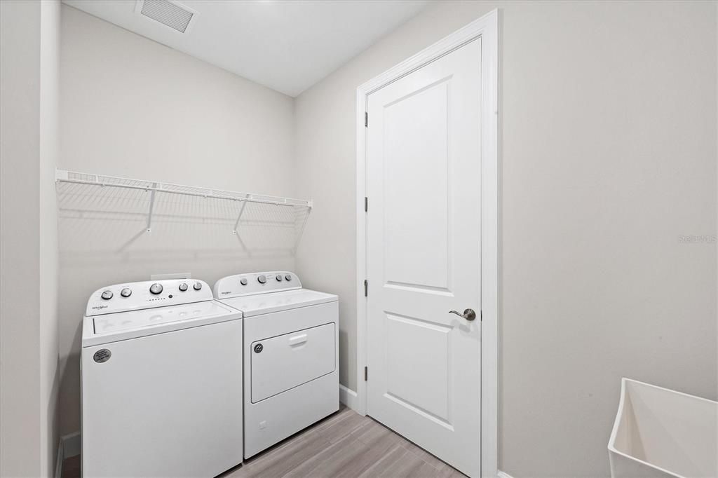 Laundry and door to Storage and HVAC