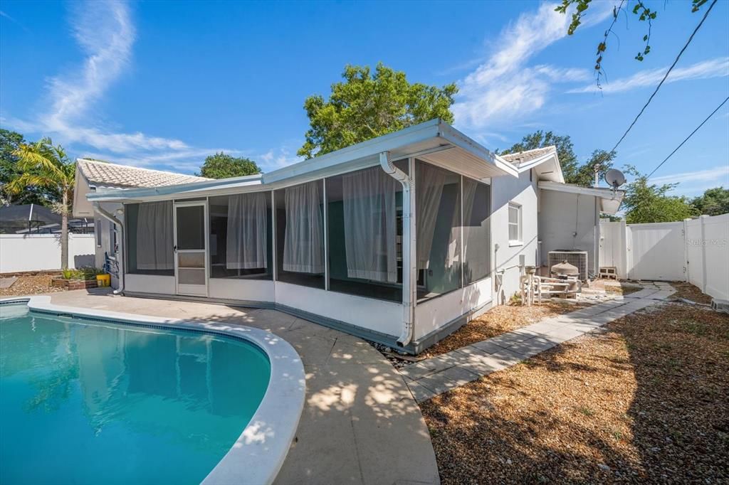 View of screened-in porch from pool