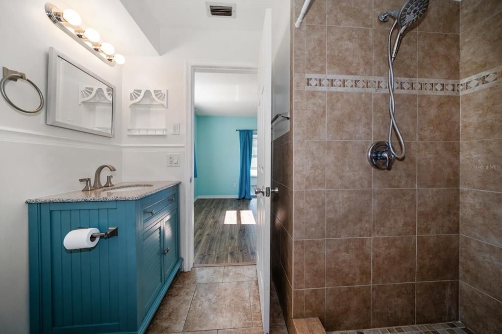 En-suite primary bath has walk-in shower