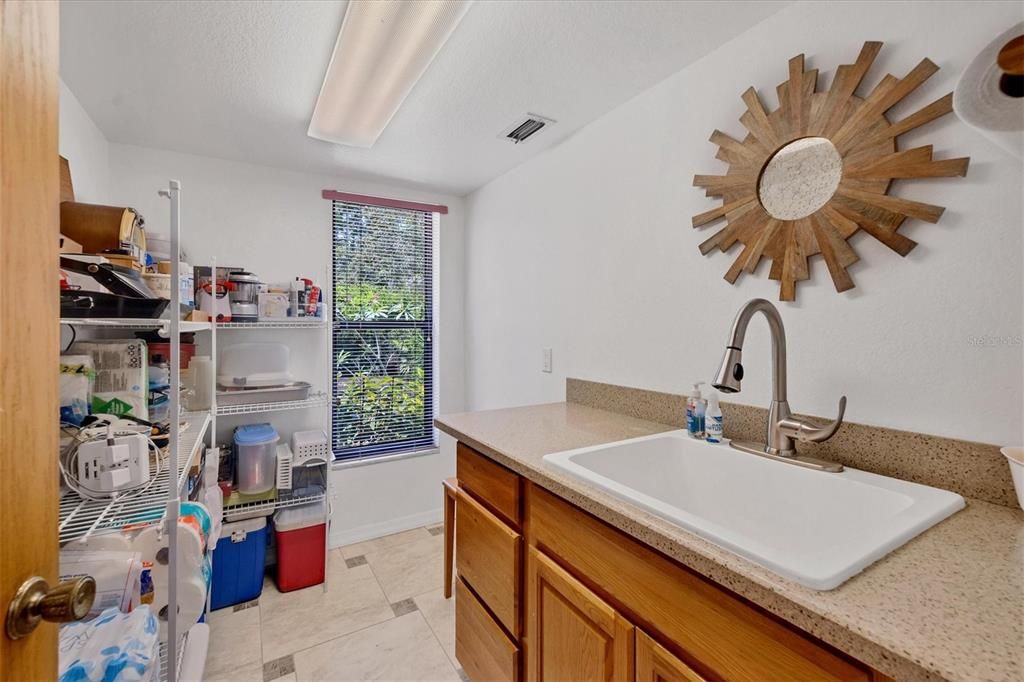 Walk in pantry with room for refrigerator or wine storage