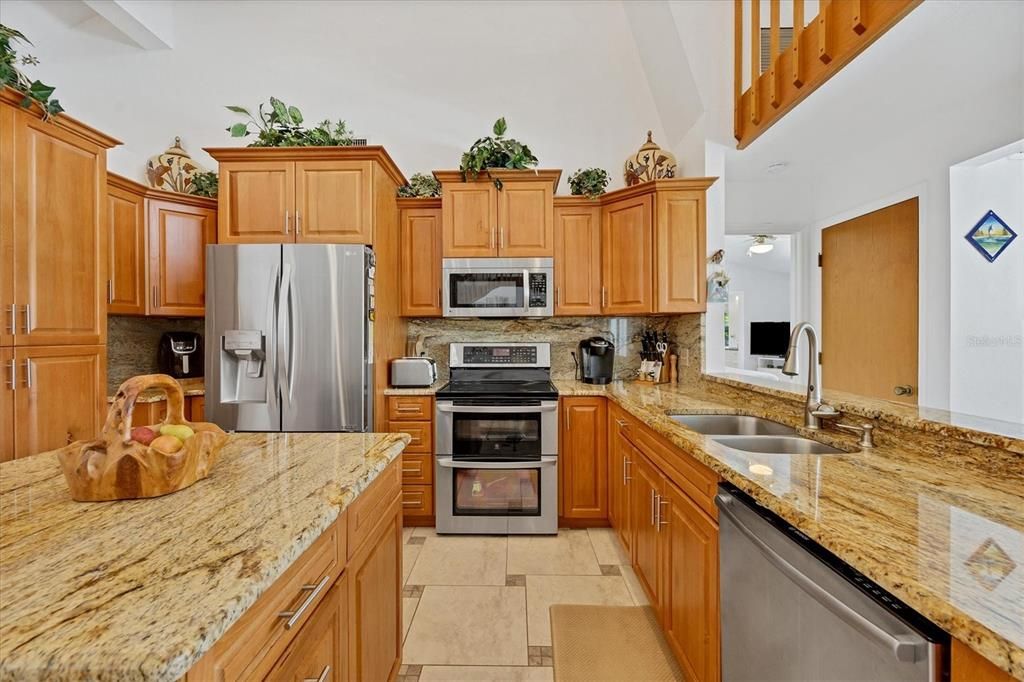 Gourmet kitchen with island and large breakfast bar